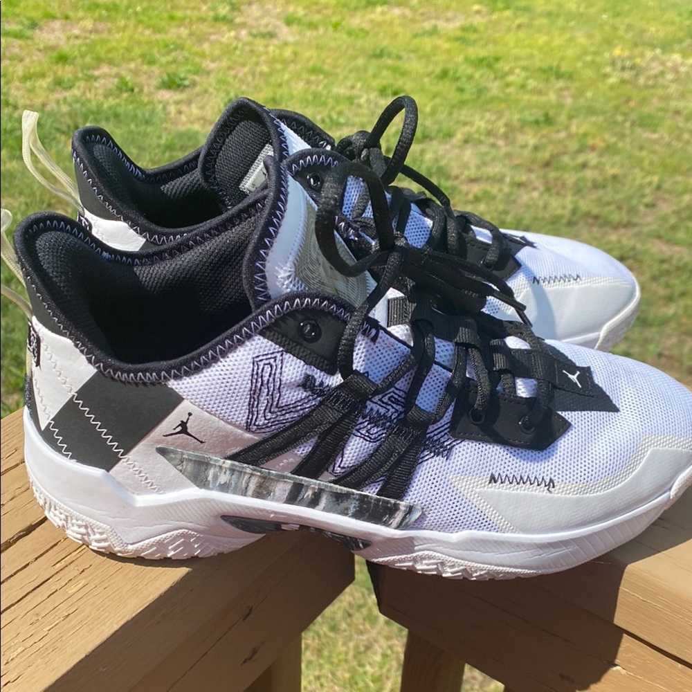 Jordan Black and White Athletic Shoes with Reflective Accents
